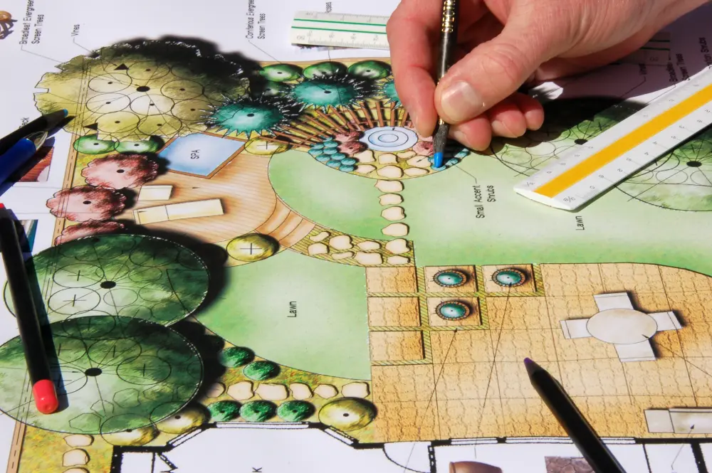 GettyImages-140453929 Hand drawing on landscape design plan.